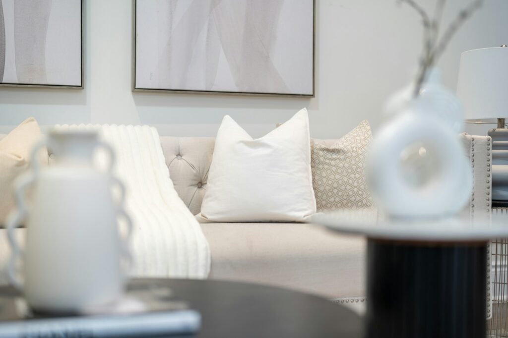 Neutral toned living room with soft seating and a woven rug